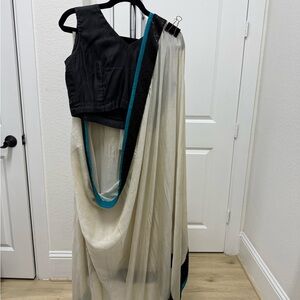 White crinkle chiffon blend sari with teal embroidered border and black blouse